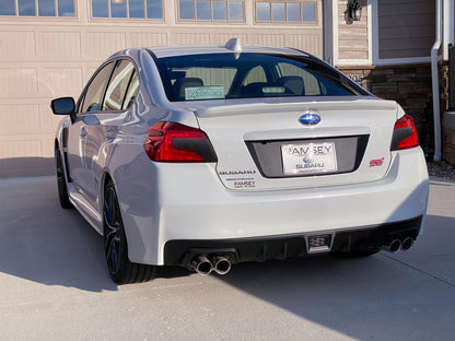 Black 3D carbon fiber license plate panel overlay for 2015-2020 Subaru WRX and STI, designed by StickerFab for exterior body enhancement.