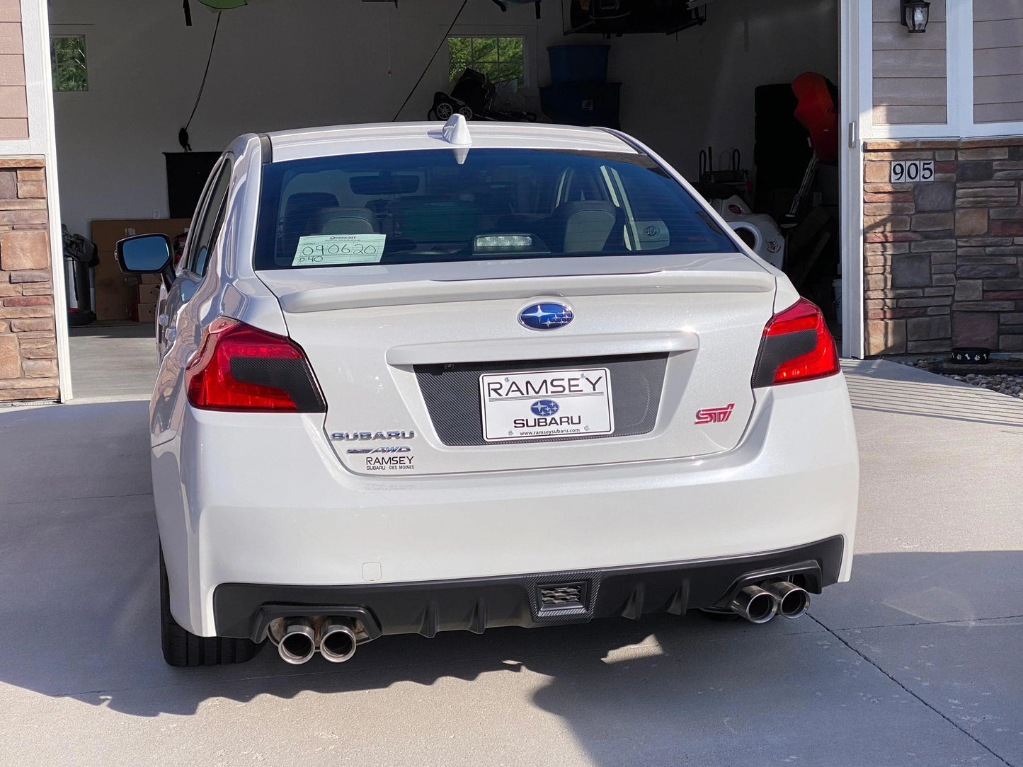 Black V2 license plate panel overlay for 2015-2020 Subaru WRX and STI, exterior body accessory by StickerFab.