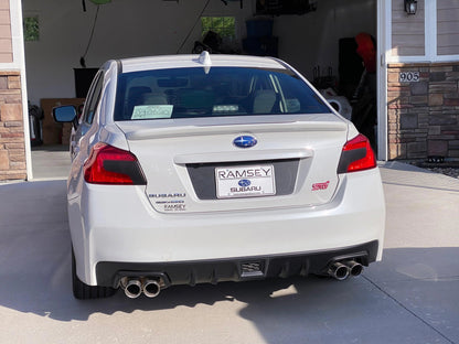 Black V2 license plate panel overlay for 2015-2020 Subaru WRX and STI, exterior body accessory by StickerFab.