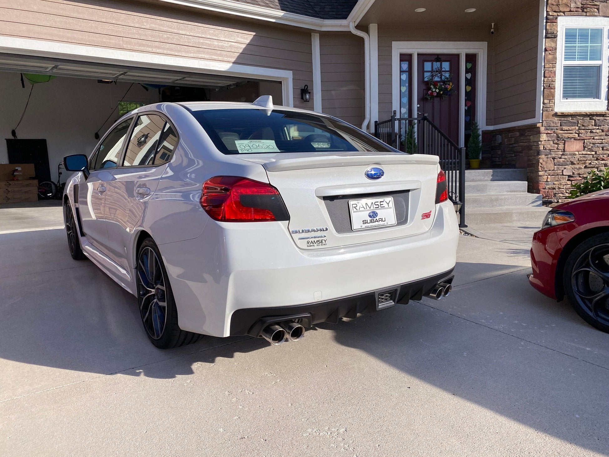 Black out V2 license plate panel overlay for 2015-2020 Subaru WRX and STI, exterior body accessory by StickerFab.
