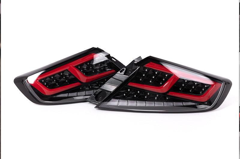 OLM Spec-AR LED taillights for 2022+ Subaru WRX, clear lens with black base and red bar, showcasing modern automotive lighting.
