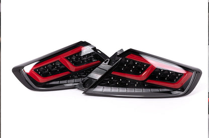 OLM Spec-AR LED taillights for 2022+ Subaru WRX, clear lens with black base and red bar, showcasing modern automotive lighting.