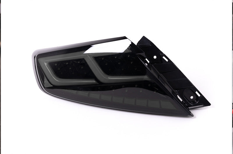 OLM Spec-AR LED taillights for 2022+ Subaru WRX, smoke lens with black base and white bar, designed for stylish vehicle lighting.