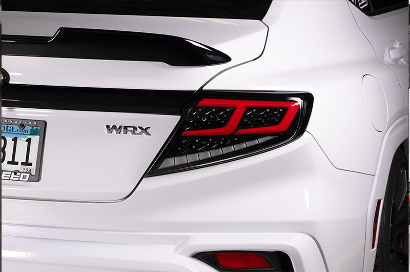 OLM Spec-AR LED taillights for 2022+ Subaru WRX, clear lens with black base and red bar, showcasing sleek automotive lighting design.